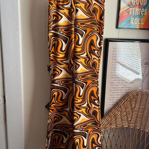 Groovy orange and brown swirl pattern flare pants #retro #boho #70s